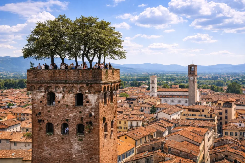 View of the Guinigi Tower with trees on the top and panorama of the historic center of Lucca during a Pisa Lucca tour